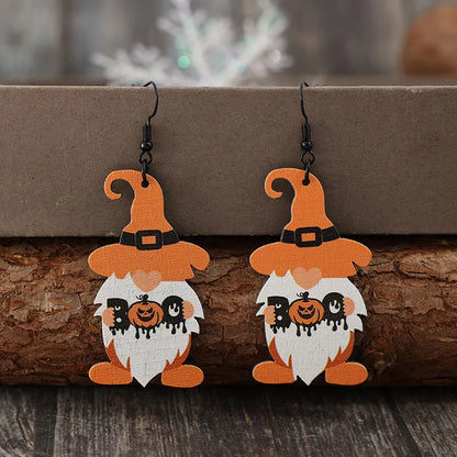 Wooden Dwarfs pumpkin dangle earrings featuring carved orange pumpkins and rustic wooden accents, stylish and festive jewelry.