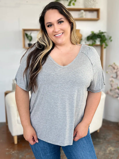 Basic Bae full-size bamboo V-neck T-shirt by Trendsi, featuring short sleeves and a slit design in natural bamboo fabric.