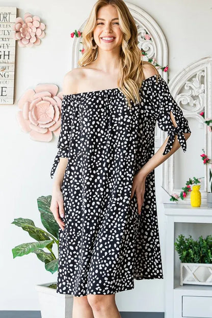 Heimish full size short sleeve off-shoulder animal mini dress in plus size, featuring a stylish, fitted silhouette and vibrant animal print.