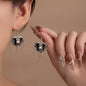 Halloween alloy heart skull earrings with chain detail, featuring gothic-inspired design and dark metallic finish.