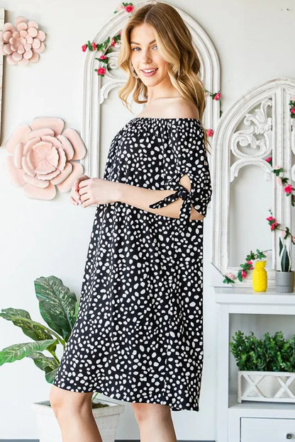Heimish plus size off-shoulder animal print mini dress with short sleeves, stylish and flattering for warm weather.