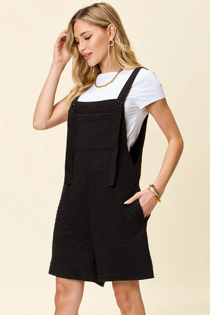 Trendsi double take full size textured square neck romper with long sleeves, featuring a stylish, fitted silhouette and square neckline.