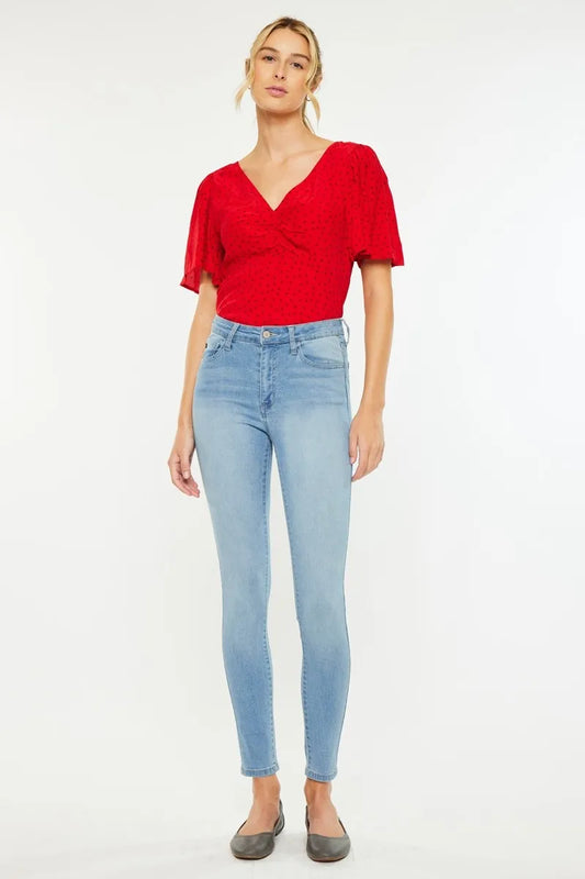 Kancan high-rise super skinny jeans in dark wash with five-pocket design and sleek fit, displayed on a mannequin.