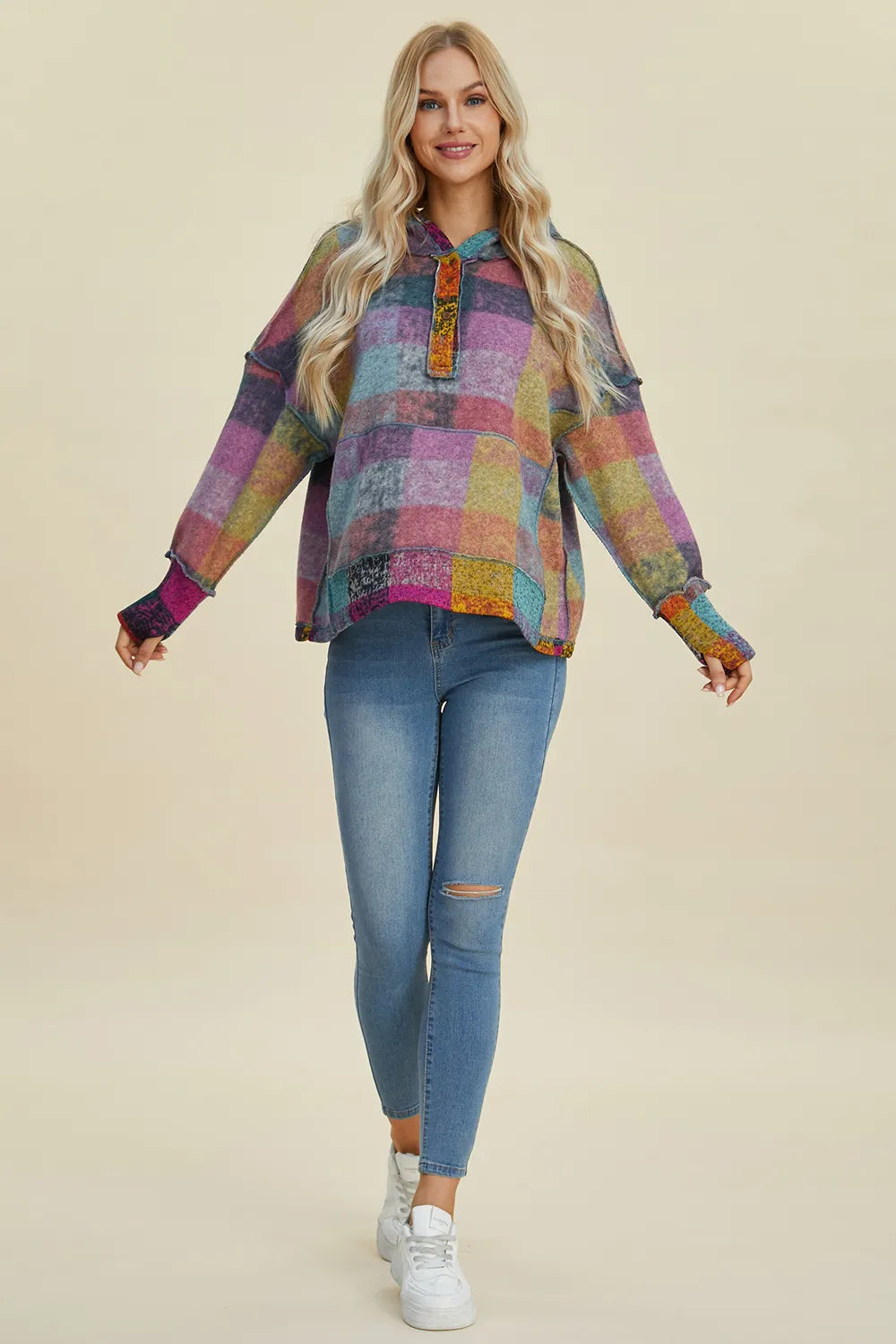 Plus size plaid fleece hoodie with dropped shoulders from Trendsi, featuring a cozy, casual design and full-size fit.