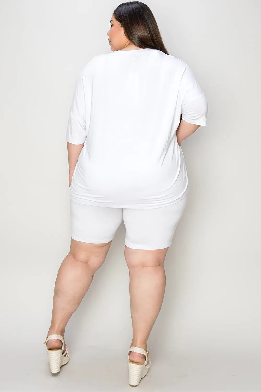 Trendsi Basic Bae bamboo full-size V-neck drop shoulder T-shirt and shorts set in natural fabric, shown on a model.