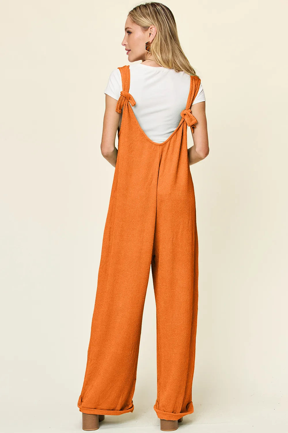Texture sleeveless wide-leg jumpsuit from Trendsi with a full size fit, featuring a stylish, modern design and comfortable fit.