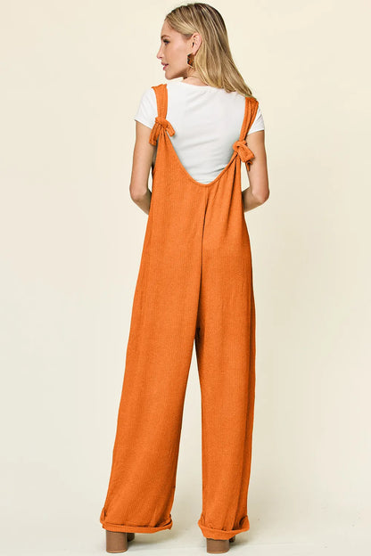 Texture sleeveless wide-leg jumpsuit from Trendsi with a full size fit, featuring a stylish, modern design and comfortable fit.