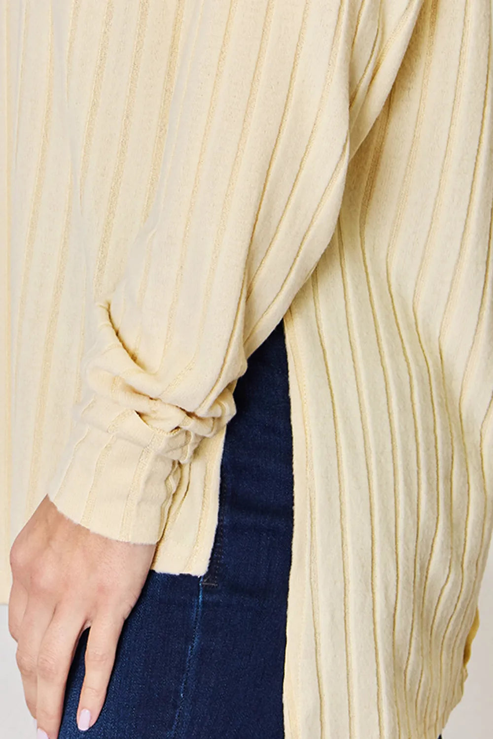 Basic Bae full-size ribbed round neck slit T-shirt by Trendsi, shown in beige with ribbed fabric and a relaxed fit.