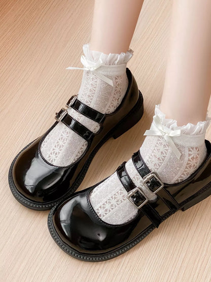 White lace bow socks by Trendsi featuring delicate lace fabric and small bow accents, perfect for cute and stylish footwear.