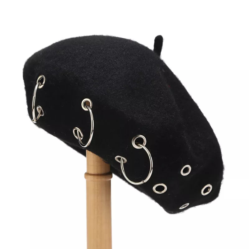 Metal ring embellished beret hat by Trendsi featuring a classic black design with shiny metal accents and a stylish, rounded shape.