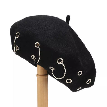 Metal ring embellished beret hat by Trendsi featuring a classic black design with shiny metal accents and a stylish, rounded shape.