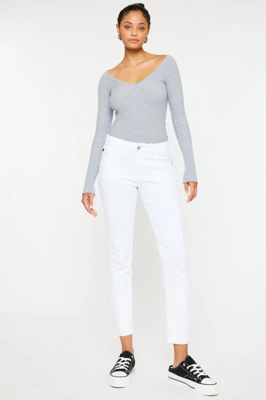Kancan mid-rise ankle skinny jeans from Trendsi, showing a close-up of the dark wash denim with fitted style and subtle stitching.