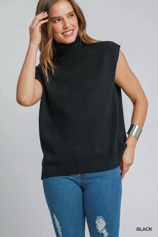 Trendsi Umgee high-low sleeveless turtleneck sweater top in soft knit fabric, shown on a hanger with a neutral background.