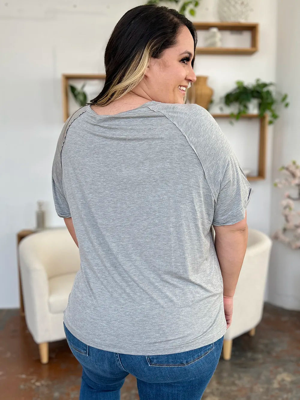 Basic Bae full-size bamboo V-neck short sleeve T-shirt by Trendsi, showing a lightweight, slit design with a relaxed fit in natural bamboo fabric.