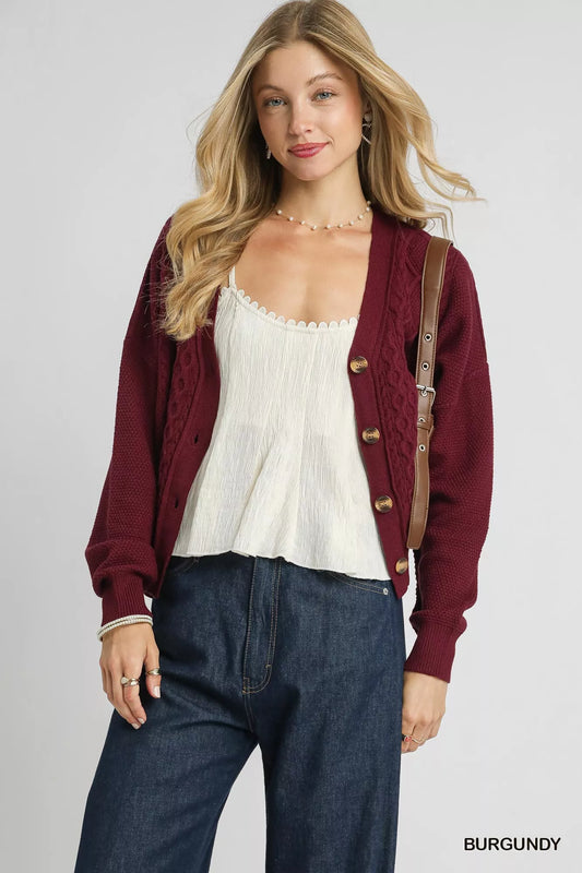 Umgee chunky cable knit V-neck button-up cardigan with long sleeves and ribbed hem, in neutral color, from Trendsi.