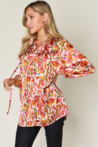 Plus size printed button-up long sleeve shirt by Trendsi, featuring a stylish full-size design with a classic collar.