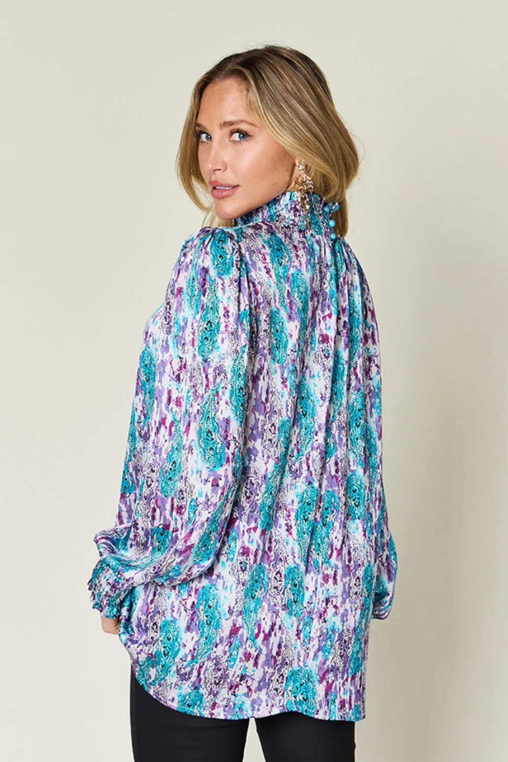 Printed smocked long sleeve blouse from Trendsi with a double take full size design, featuring a stylish and comfortable fit.