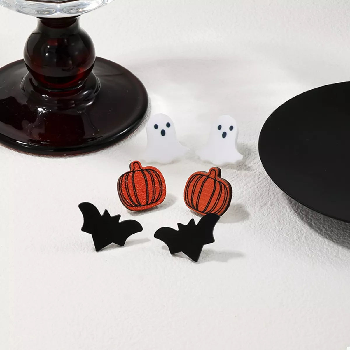 Set of three Halloween-themed stud earrings featuring spooky designs, perfect for festive accessories and stylish costume jewelry.