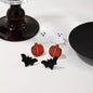 Set of three Halloween-themed stud earrings featuring spooky designs, perfect for festive accessories and stylish costume jewelry.