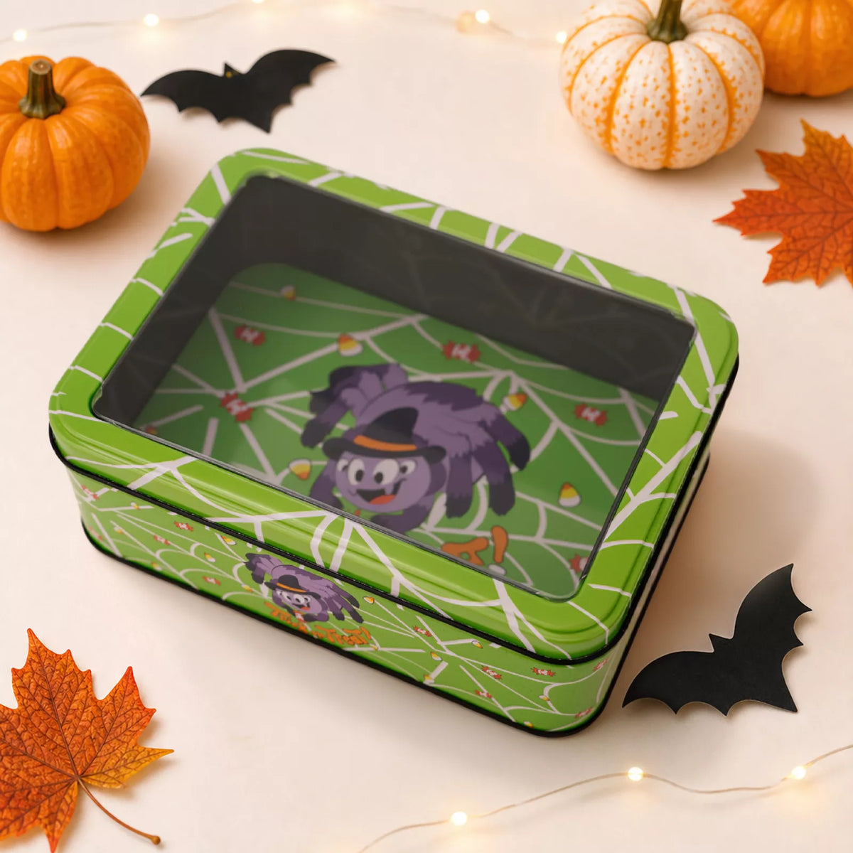 Halloween decorative metal storage box with window display, featuring spooky design and vintage style from Trendsi.