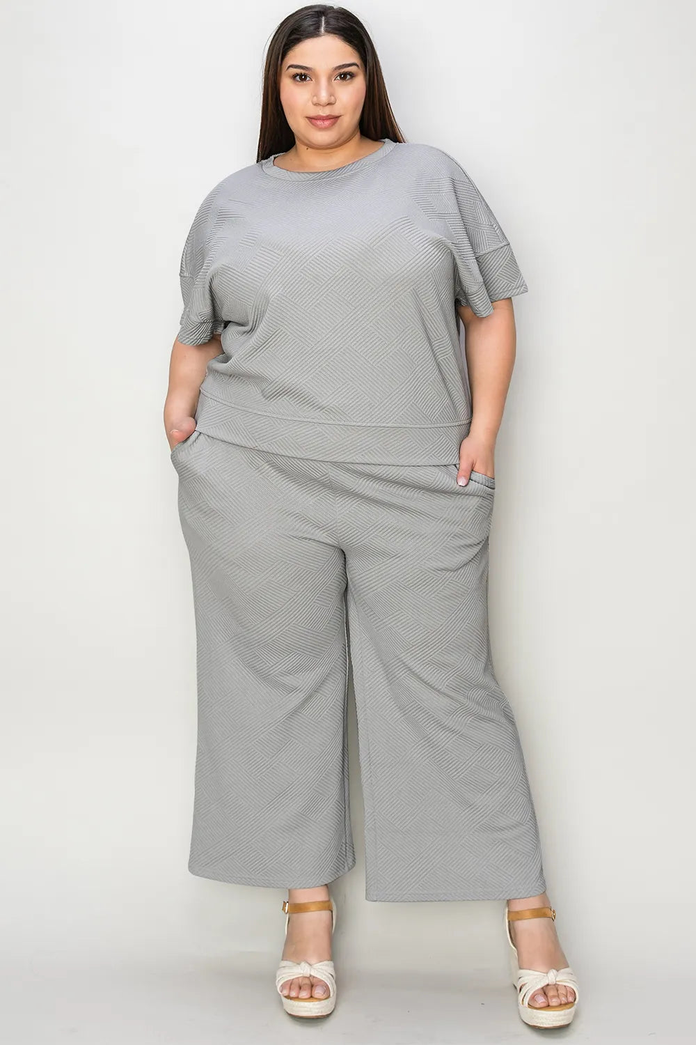 Trendsi Double Take full size textured short sleeve top and matching pants set, stylish casual outfit with a comfortable fit.