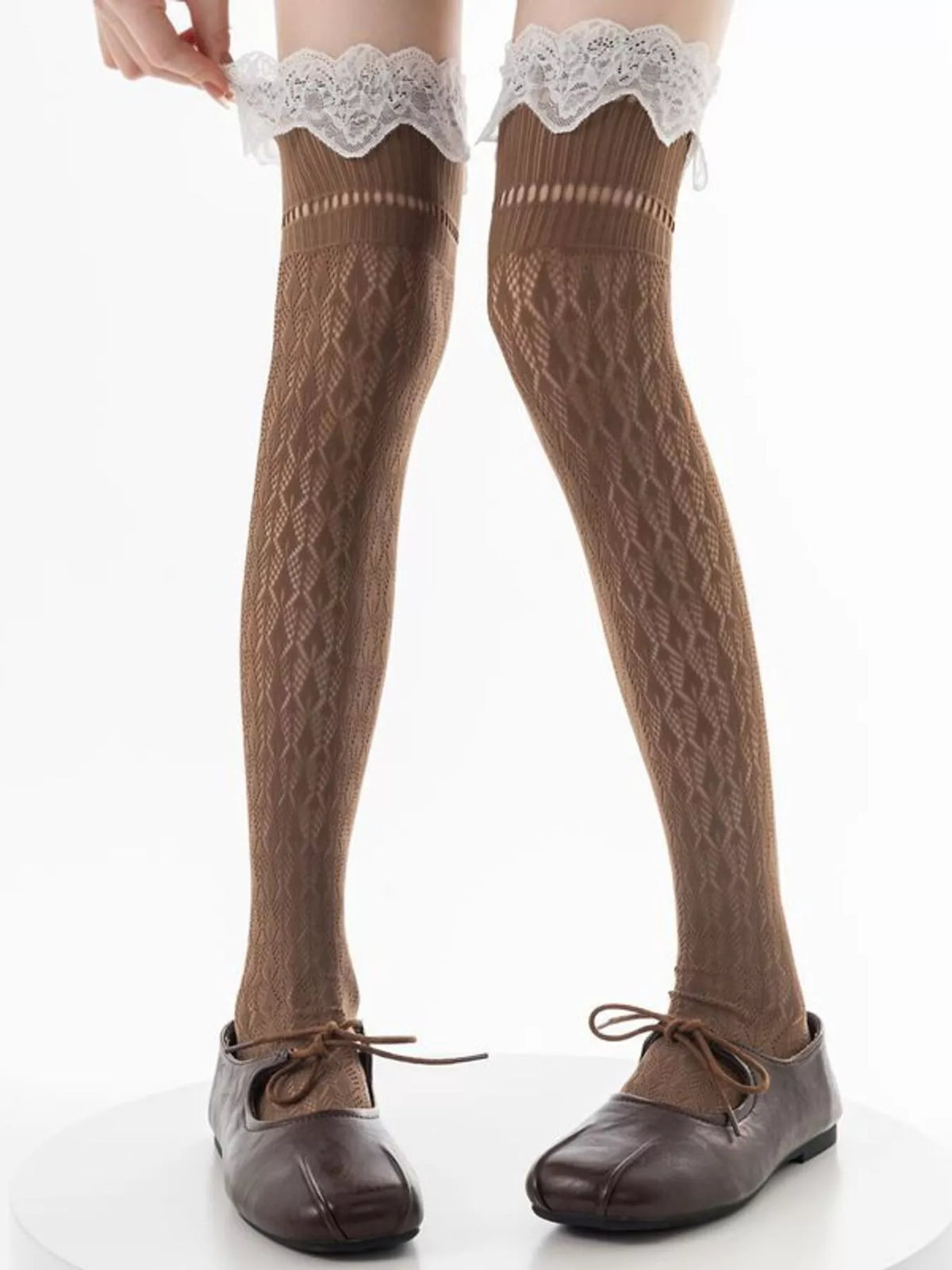 Lace over-the-knee hollow-out stockings by Trendsi featuring intricate lace details and sheer hollow-out design.