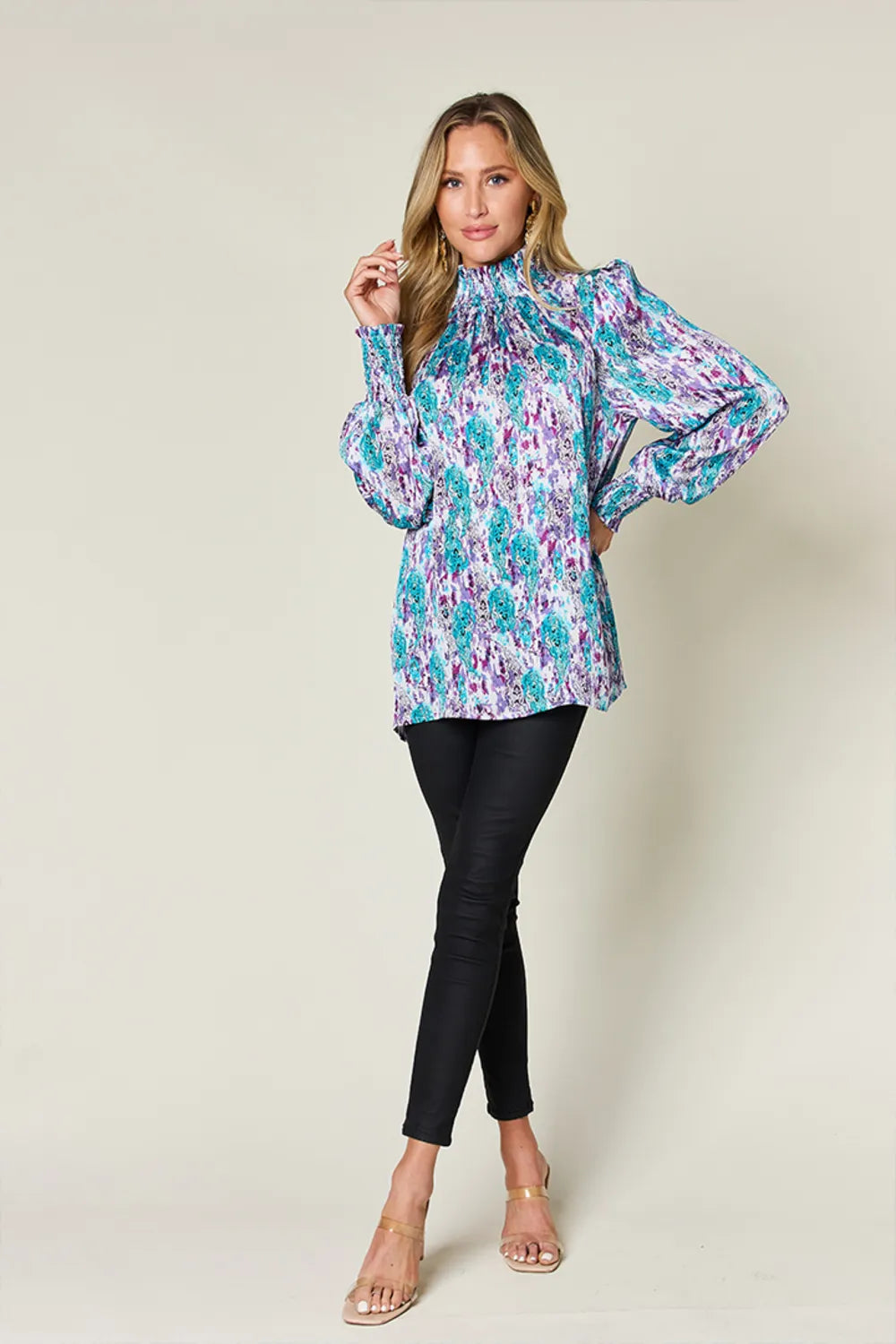 Printed smocked long sleeve blouse from Trendsi with a double take full size design, featuring a flowy fit and stylish pattern.