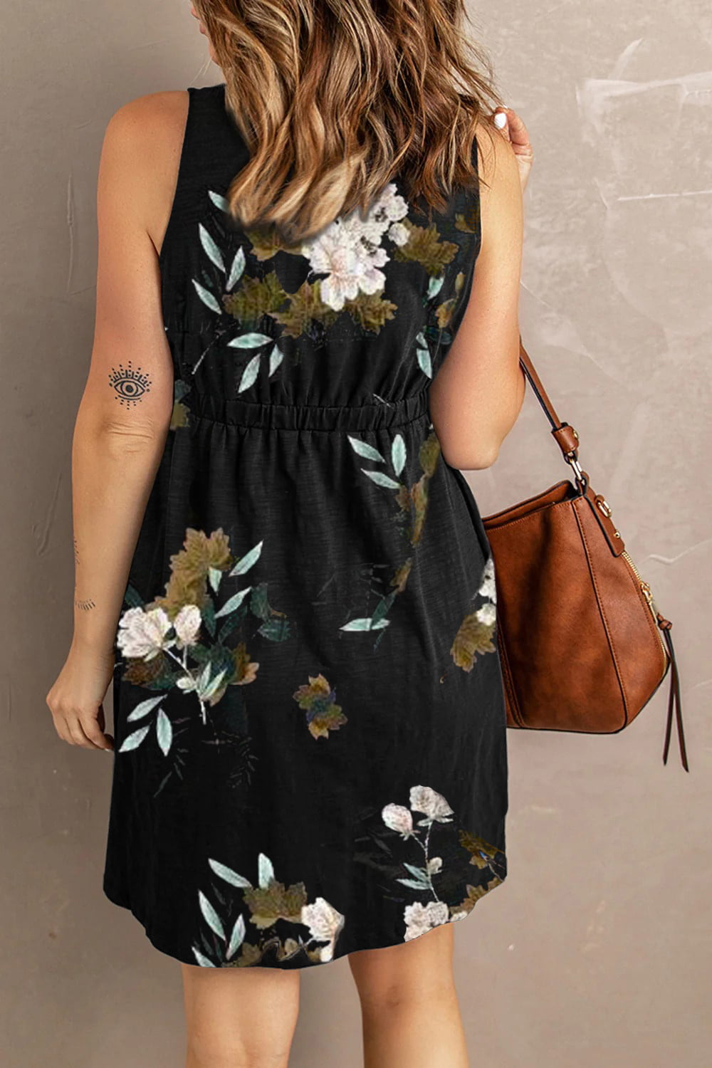Printed sleeveless casual dress by Trendsi featuring front buttons, ruched waist, side slit, and pockets.