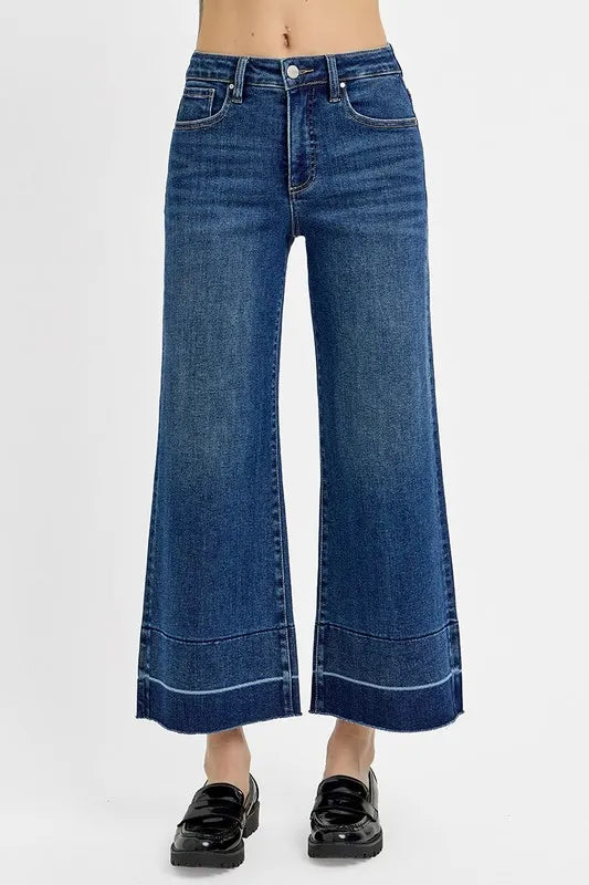 Plus size RISEN high waist crop jeans with tummy control, wide hem, and full length, featuring a trendy wide-leg silhouette.