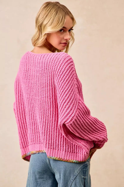 BiBi V-neck sweater by Trendsi featuring colorful trim, soft knit fabric, and a relaxed fit with vibrant accents.