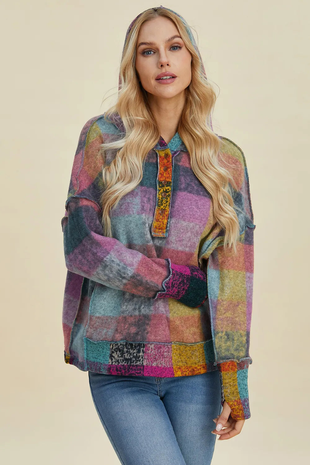 Plus size plaid fleece hoodie with dropped shoulders from Trendsi, featuring a cozy, oversized fit and stylish plaid pattern.