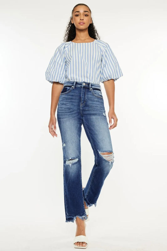 Kancan high rise distressed slim straight jeans in light wash denim, showing front view with rips and fitted style