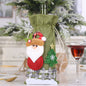 Assorted 2-piece Christmas doll wine bottle covers featuring festive holiday character designs by Trendsi.