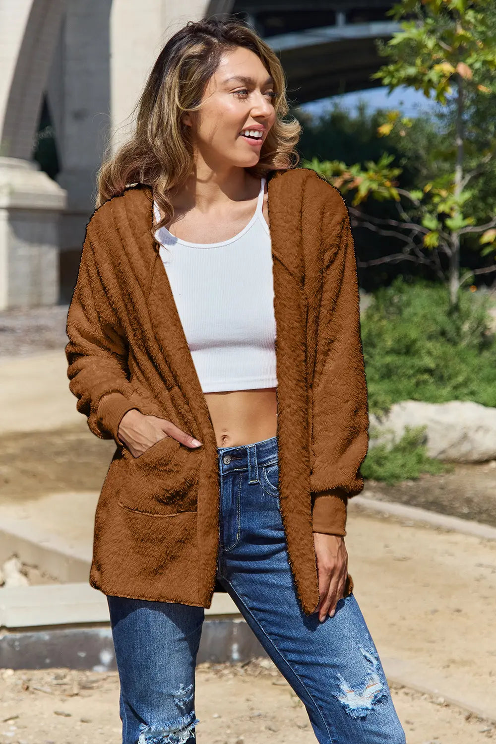 Full size Teddy hooded jacket with pockets from Trendsi, featuring a soft plush fabric and cozy hood for cold weather.