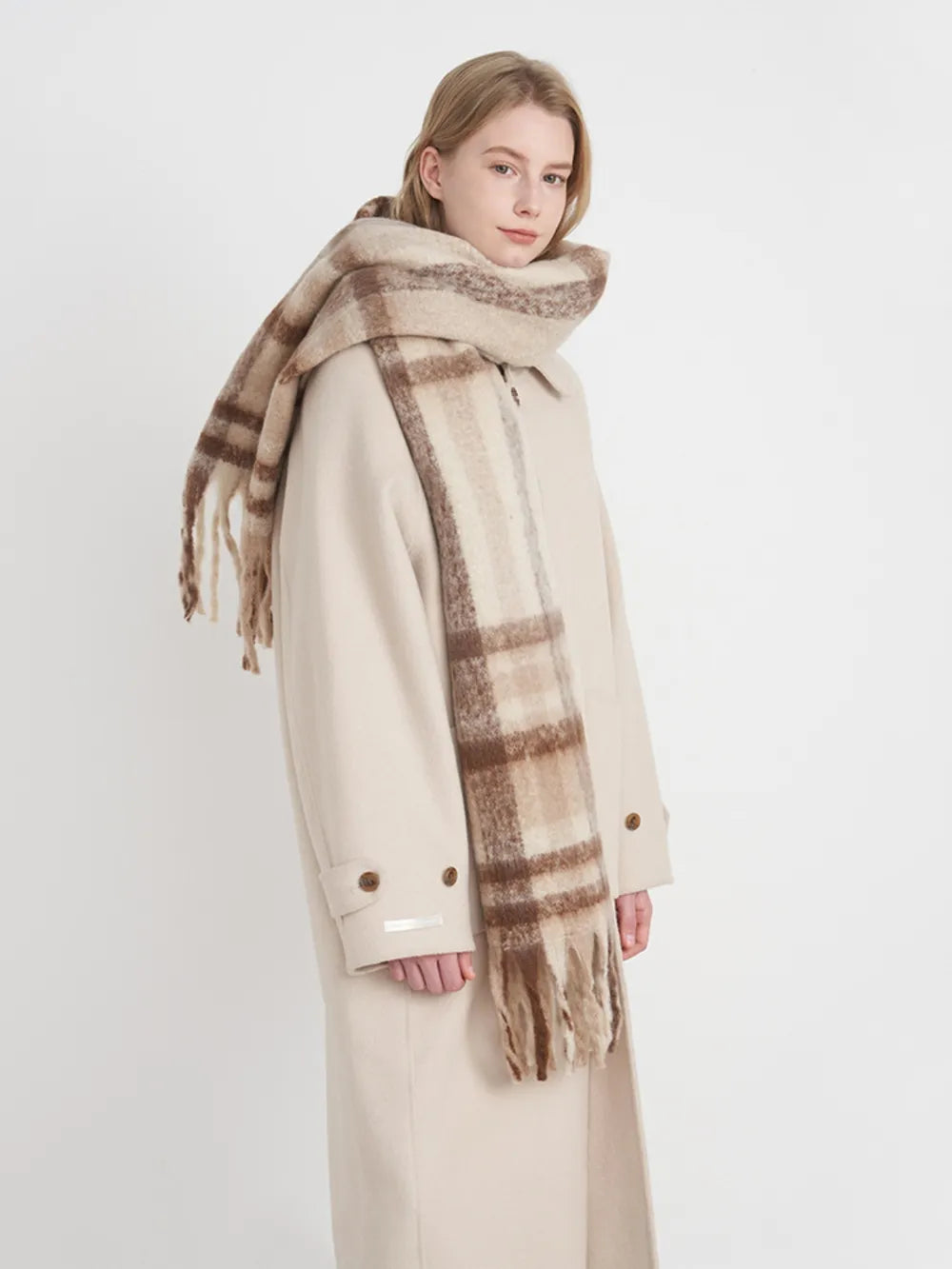 Fringe plaid polyester scarf featuring a stylish pattern with fringed edges, perfect for casual or layered winter outfits.