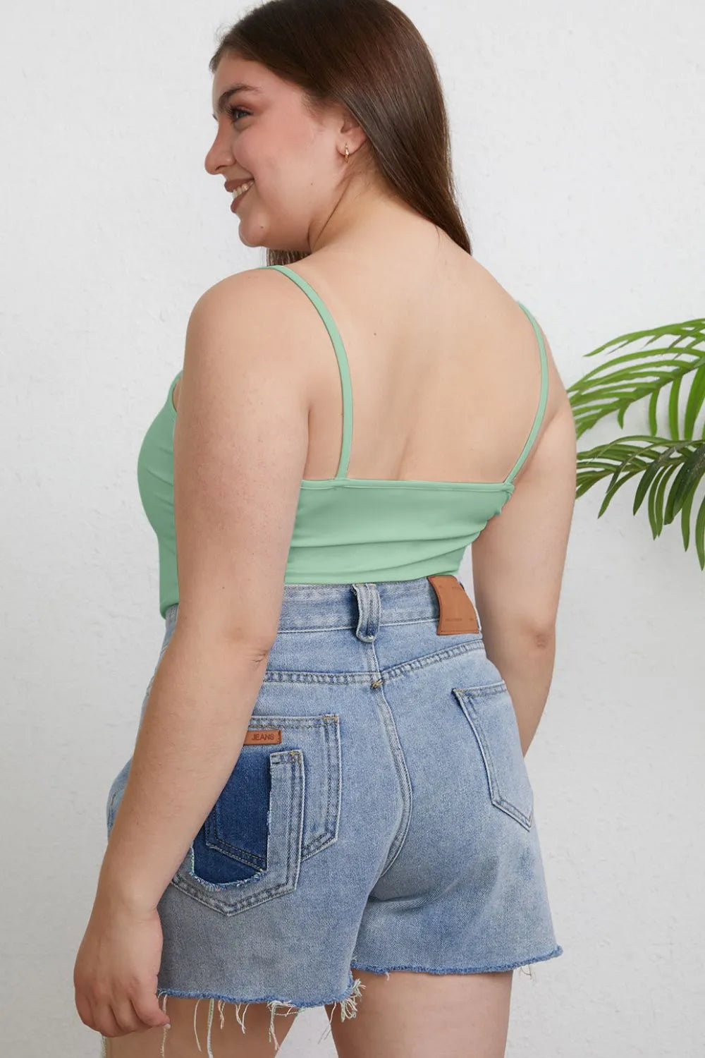 Plus size Basic Bae full-size round neck slim cami by Trendsi, featuring a fitted design and classic round neckline.