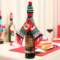 Christmas hat and scarf wine bottle decoration by Trendsi, festive holiday accessory for wine bottles with red and green accents.