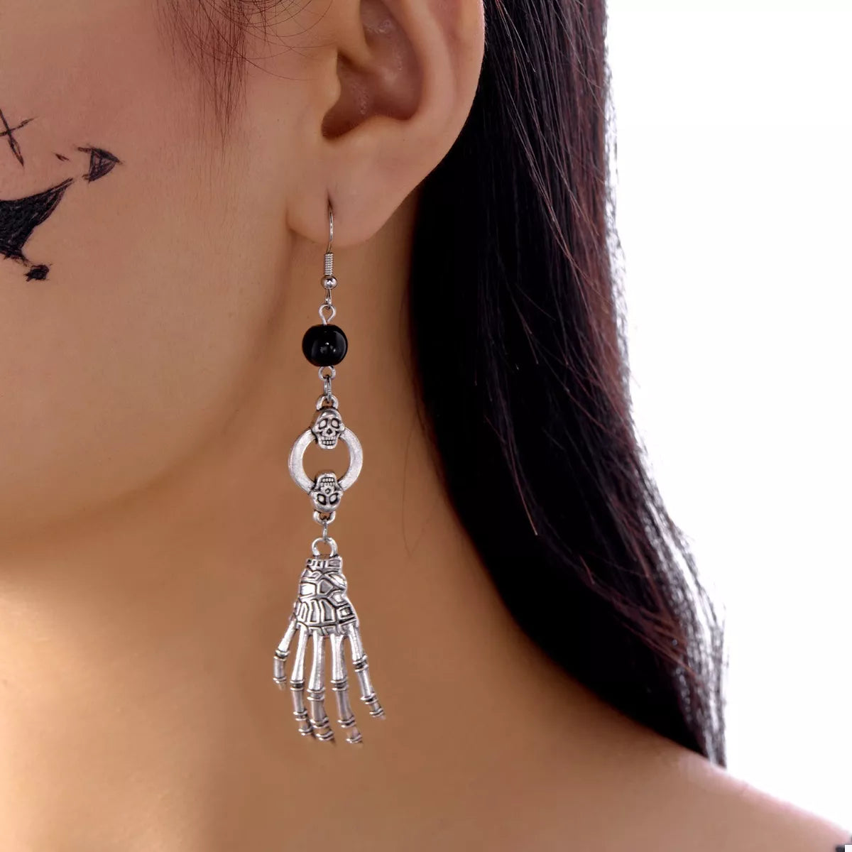 Halloween Skeleton Hand Drop Earrings featuring detailed skeletal hand design, stylish jewelry from Trendsi.