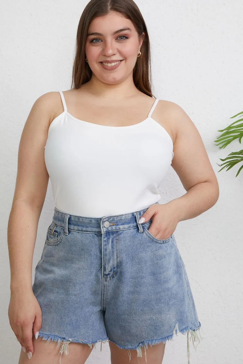 Plus size Basic Bae full size round neck slim camisole by Trendsi, showing a close-up of the soft, fitted fabric in a neutral color.