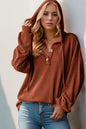 Long sleeve hoodie by Trendsi with full size, half button front, and a casual, comfortable design.