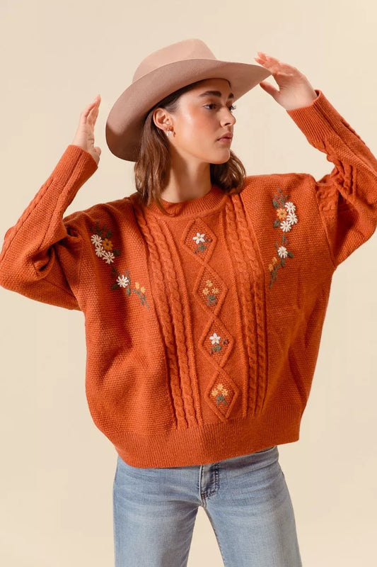 Trendsi SO ME embroidered flower cable knitted sweater featuring colorful floral embroidery on a cozy cable-knit design