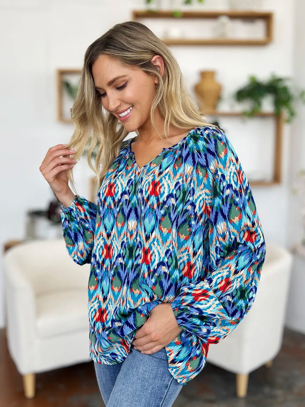 Printed balloon sleeve blouse by Trendsi with full size fit, featuring a stylish design and vibrant print on lightweight fabric.
