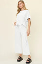 Trendsi Double Take full-size textured round neck short sleeve T-shirt with wide-leg pants, casual and comfortable outfit.