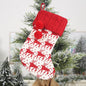 Red Christmas stocking hanging widget with white cuff and festive design, ideal for holiday decoration from Trendsi.
