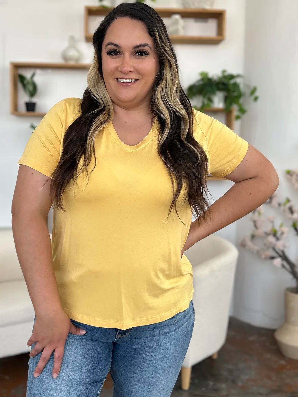 Basic Bae Bamboo full-size V-neck high-low T-shirt by Trendsi, showing the soft bamboo fabric, V-neckline, and high-low hem design.