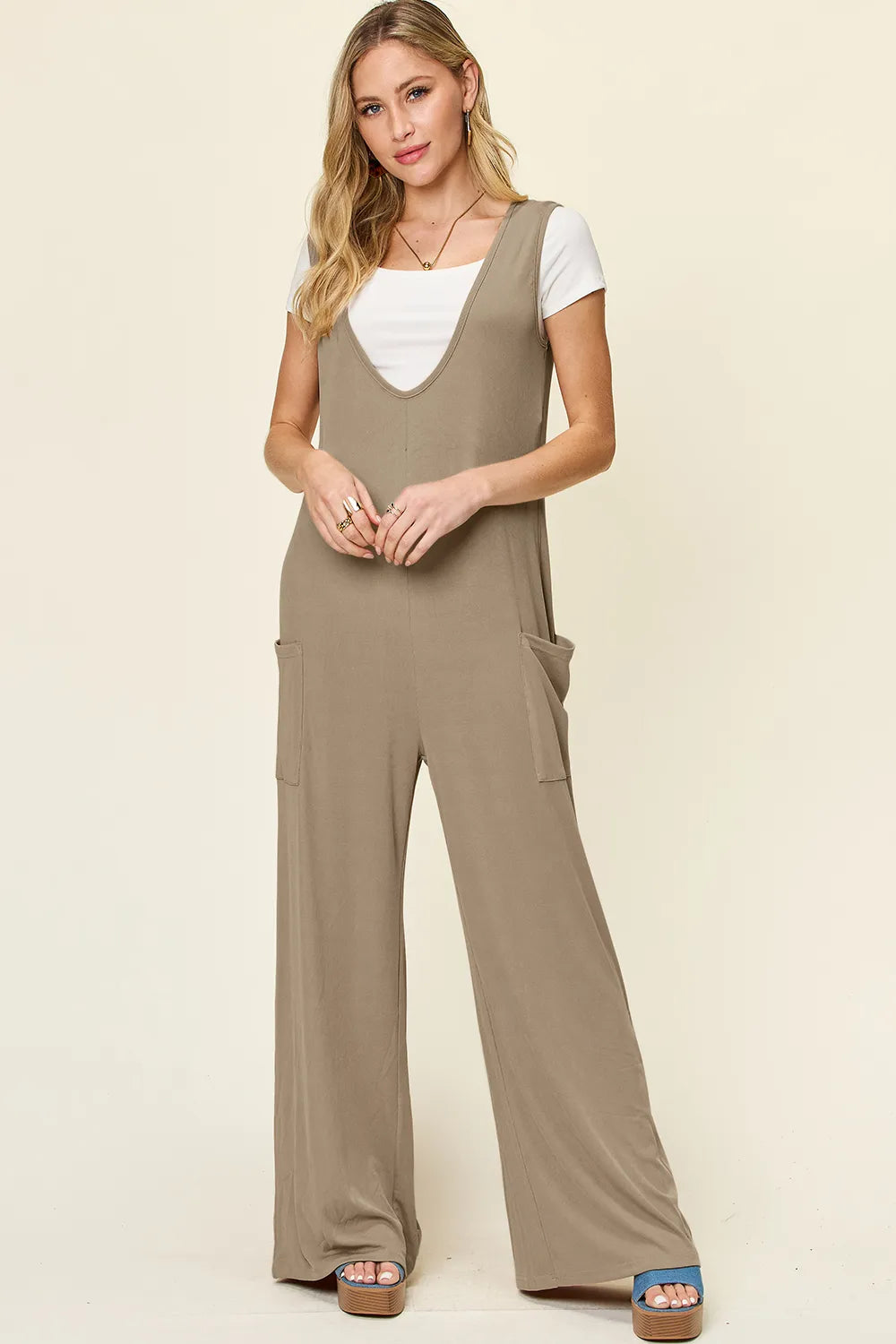 Plus size Trendsi double take sleeveless wide-leg jumpsuit with pockets, full length, and comfortable fit.