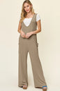 Plus size Trendsi double take sleeveless wide-leg jumpsuit with pockets, full length, and comfortable fit.