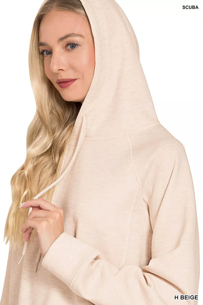 Black Zenana drawstring scuba hoodie with front kangaroo pocket and hood, made by Trendsi, shown on a model.
