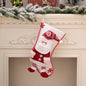 Red Christmas stocking hanging widget from Trendsi with festive design, ideal for holiday decor and seasonal decoration.