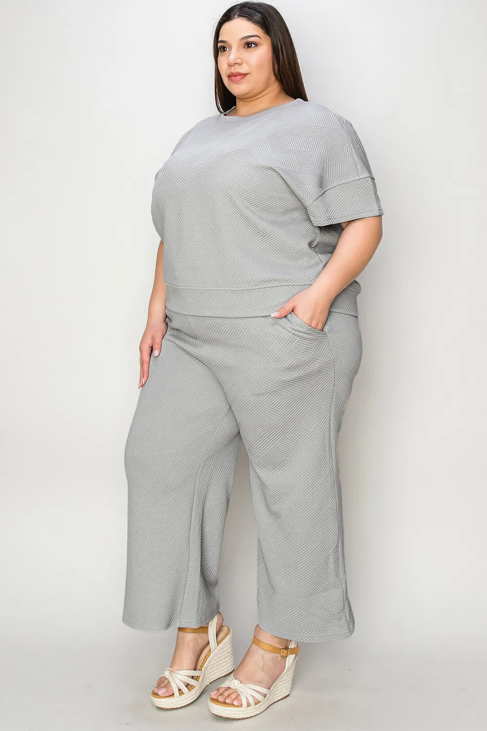 Trendsi Double Take full size textured short sleeve top and matching pants set, stylish and comfortable for casual wear.